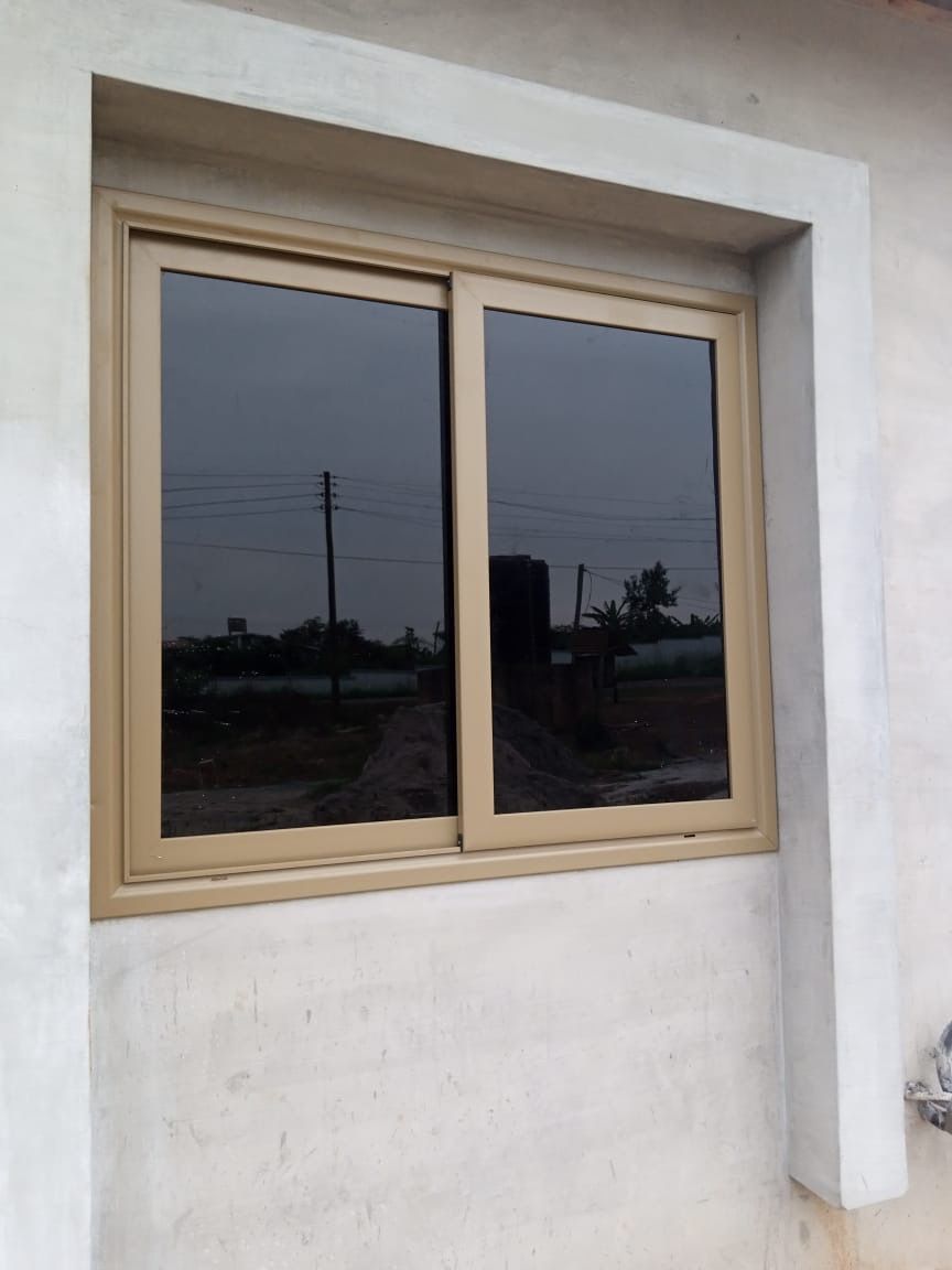 Cream Framed Sliding Window